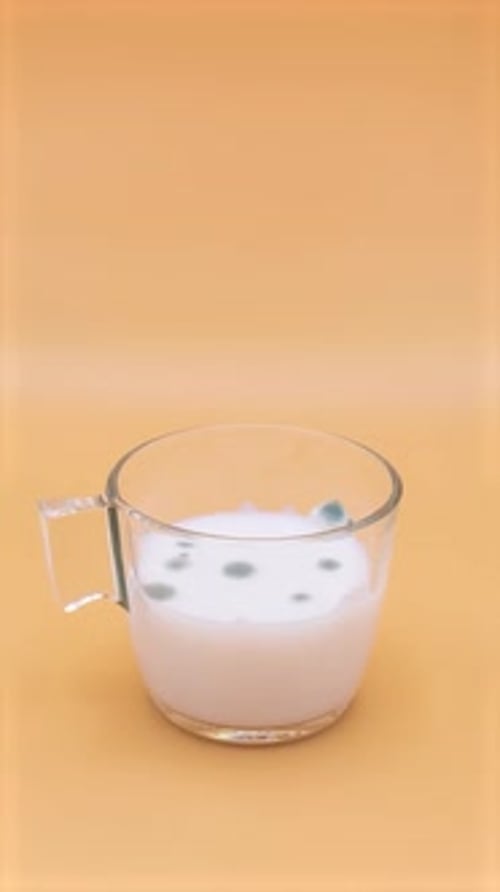 Milk in a glass getting spoiled. 3 weeks in 20 seconds. Timelapse