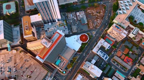 Above the tops of the buildings, parking lot and roads of the city of Honolulu, Hawaii, USA.