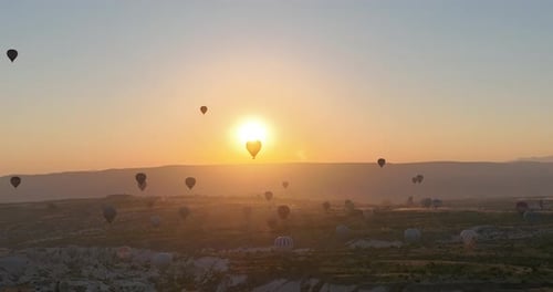 Aerial Cinematic Drone View of Colorful Hot Air Balloon Flying Over Cappadocia