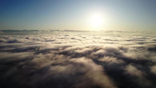 Sunlight Over Sea Of Clouds At Dawn. Aerial Wide Shot