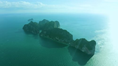 Aerial view of iconic tropical turquoise water Pileh Lagoon surrounded by limestone cliffs, Phi Phi