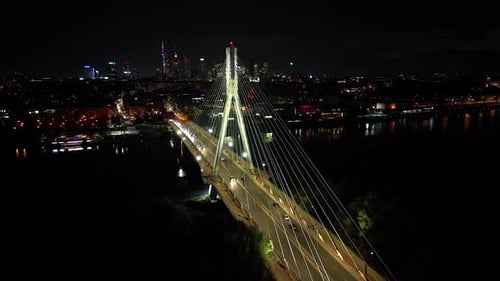 Aerial panoramic shot of Warsaw cityscape. Swietokrzyski suspension bridge over Vistula river, skysc