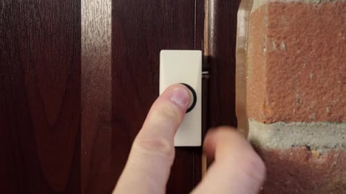 Front Doorbell Press. Man ringing doorbell. Slide in shot