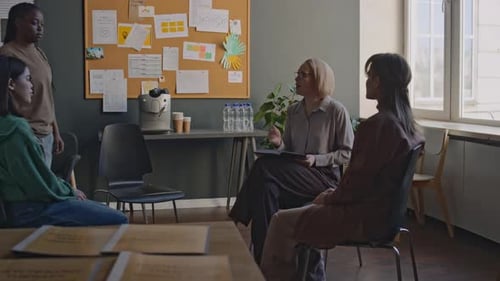 Group Therapy Session with Women in Bright Office