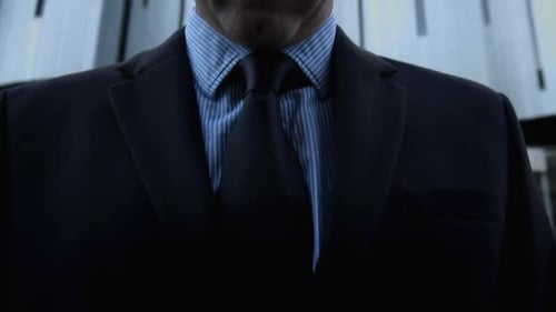 Suits Business Man Fixing His Tie Before a Deal in the City