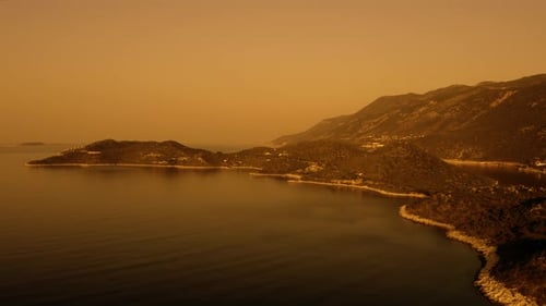 Sea Bay Surrounded By Mountains at Sunset