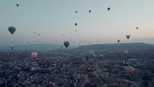Cappadocia Cityscape with Colorful Hot Air Balloons at Sunrise