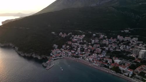 A drone flies over a beautiful seaside town on the Mediterranean coast. Aerial view.