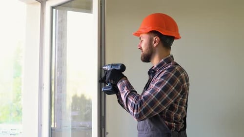 Construction Worker Installing and Checking Pvc Window or Door in the House