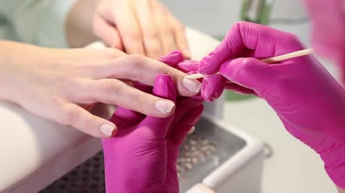 Woman Receives Professional Manicure at a Nail Salon