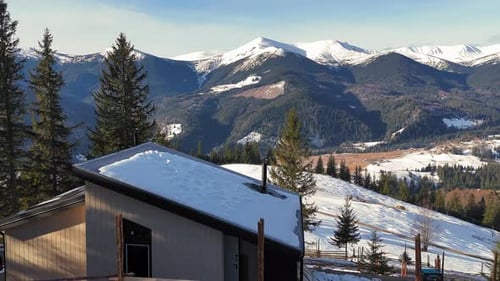 Winter Mountain House Scene with Snow Covered Peaks