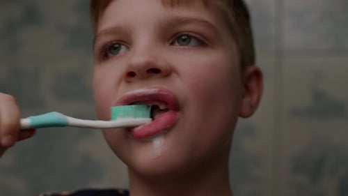 Child Brushing Teeth Close Up