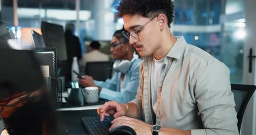 Computer, glasses and typing with man at desk in office as graphic designer for coworking