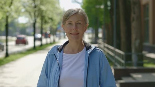 Portrait of the Smiled Mature Woman Looking at the Camera Before the Training