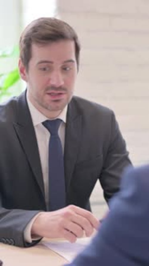 Angry Businessman with Employee in Office, vertical video