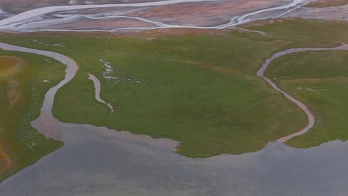 Aerial View of Braided River and Volcanic Landscape in Iceland