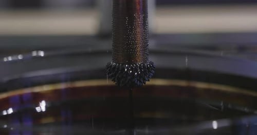 In a metallurgical industry, a magnet is dipped in a liquid metal.