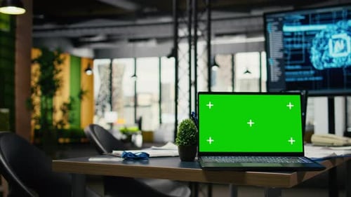 Green Screen Laptop in Empty Office Used to Accelerate AI Calculations