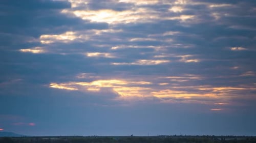 Rays of the Sun Shine Through Clouds Over Black Sea