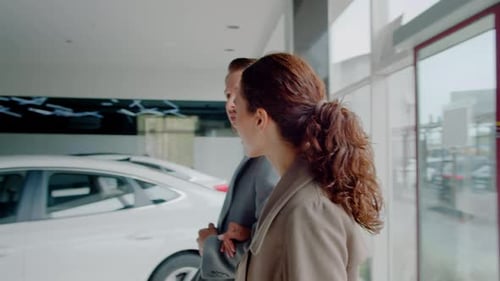 Young Married Couple Comes Into Dealership to Choose New Car