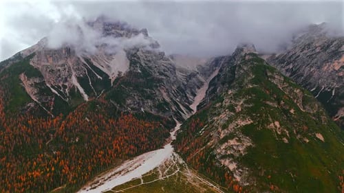 Aerial View of High Mountain Range Covered with Clouds in Dolomites Italy