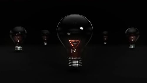 Energetic Exploding Light Bulb On Black Background