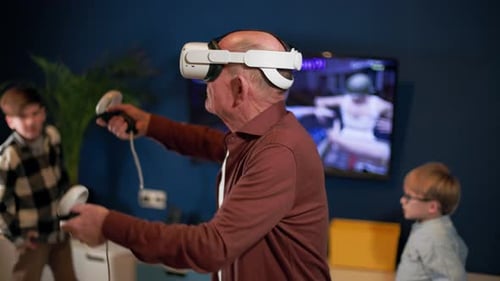 Senior Man Enjoys VR Game with Boys