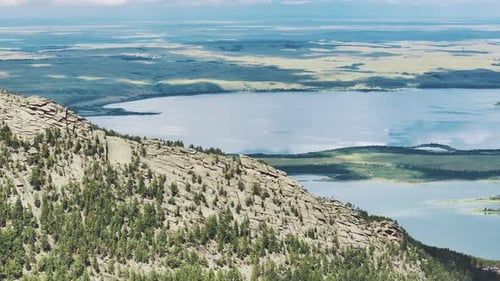 Lake At The Foot Of The Mountain On A Sunny Summer Day