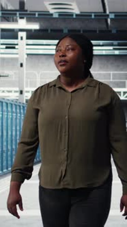 Vertical Video Admin Walking in Data Center Overseeing Large Scale IT Infrastructure