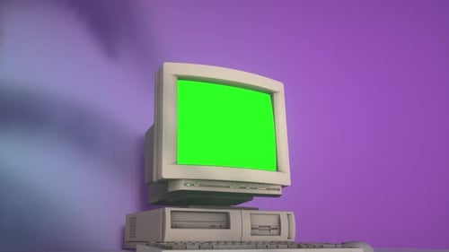 Retro Personal Computer with Keyboard on a Desktop with Green Screen