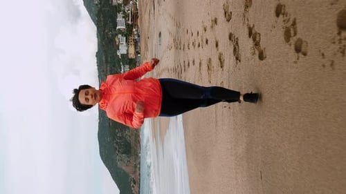 Woman Jogging on Sandy Beach