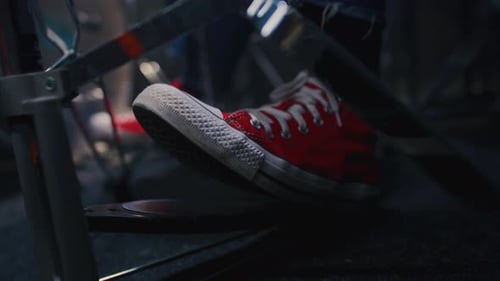 Close Up Foot in a Red Shoe Presses on Pedal of Drums Rhythmically Playing Drummer Hits Bass Drum