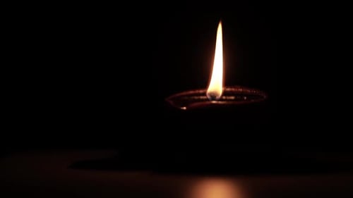 Oil Lamp Burning in the Dark