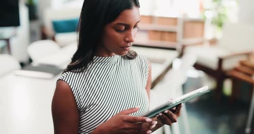 Creative, woman and typing with tablet in office for research, proofreading and update draft