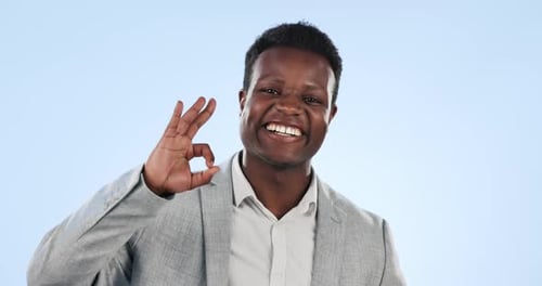 Ok, hand and face of black man with sign for yes in studio with emoji for thank you