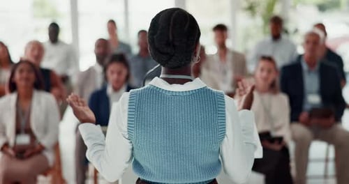 Woman Giving Presentation at a Corporate Conference