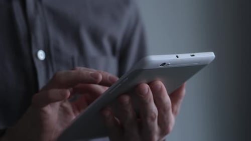 Closeup of Hand of Man Using Tablet Pc