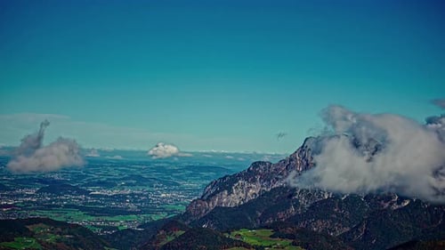 Majestic Austrian Alps With Rolling Clouds In Central Europe. Timelapse