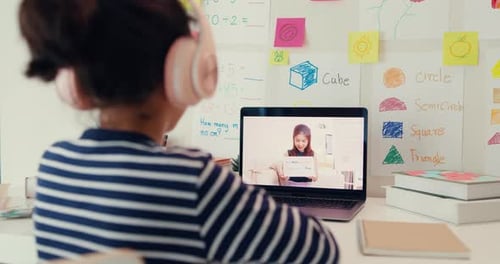 Child Learning Online at Home with Laptop