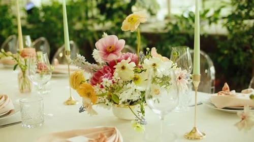 Wedding Table Setting with Floral Centerpiece and Candles
