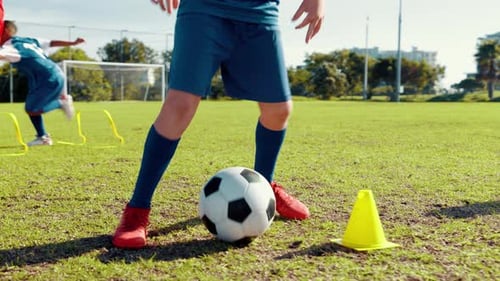 Playing, soccer and feet with ball, kick and energy for training on sports field