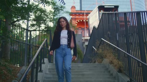 Cute Happy Girl Walk Down Stairs City Park. Confident Asian Woman Going