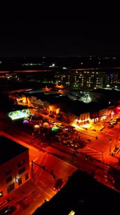 Aerial Night View of a Quiet City Intersection and Railroad Crossing