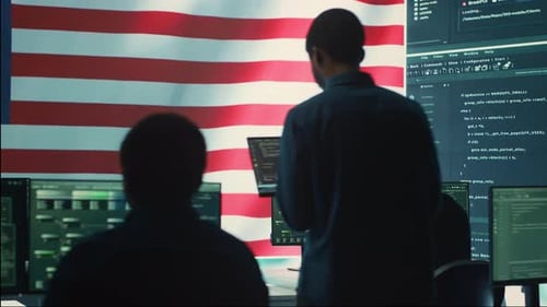 Three People Working at Computers in Cyber Security Office