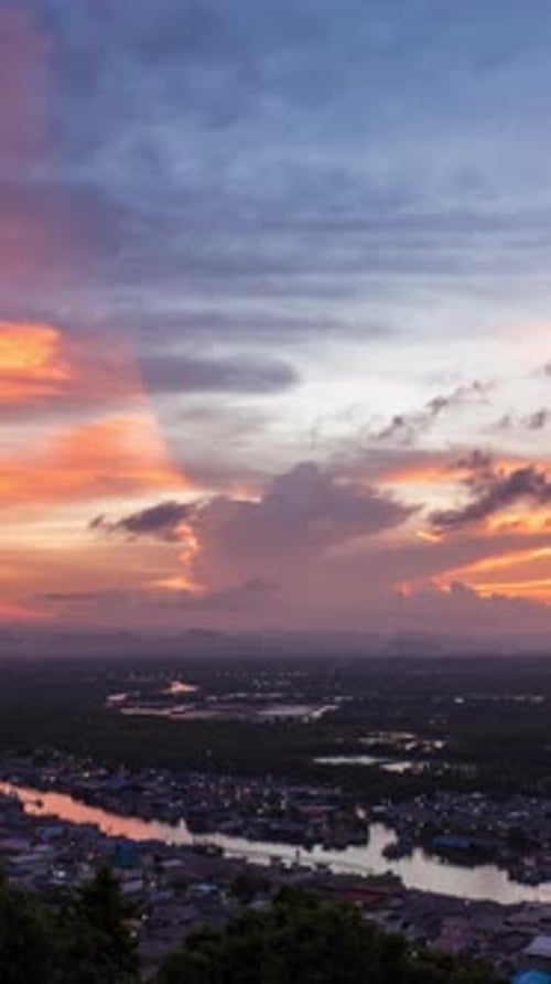 Twilight and dawn sky with cumulus cloud vertical time lapse in an evening at a small town.