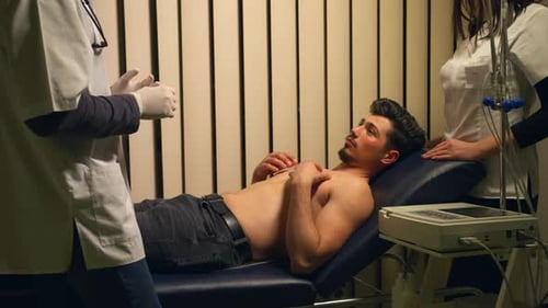 Young Adult Man Undergoing Medical Examination
