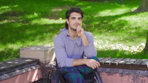 Very thoughtful disabled individual in slow motion.