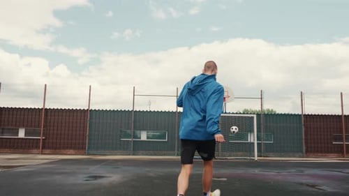 Man Practices Kicks and Tricks with Soccer Ball