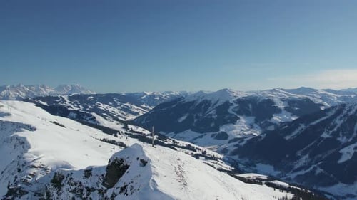 Summit Cross Near Reiterkogel And Hasenauer Köpfl Mountains In Saalbach-Hinterglemm, Austria. Aerial