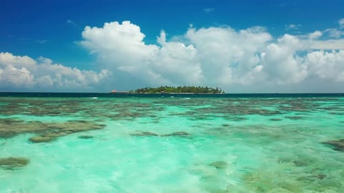 Above Fly View on Water and Tropical Island with the Turquoise Sea Coconut Palm Trees and Deep Blue